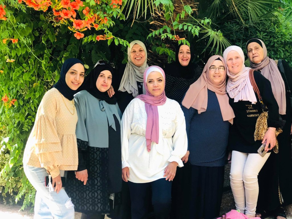 eight woman posing for a photo